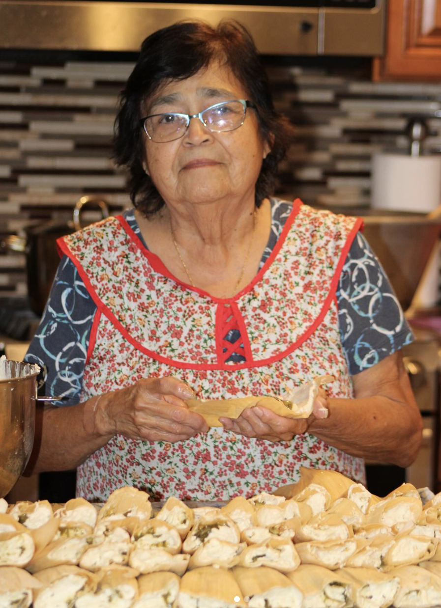 Yolanda Ramos making tamales by hand in the kitchen